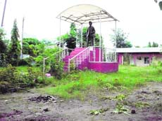 Wild grass and litter surround the statue of Shaheed Karnail Singh Issru at Issru village, Ludhiana district. 