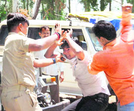 Cops beat up an engineering college student who was protesting against death of another student at a hospital, in Allahabad on Wednesday.