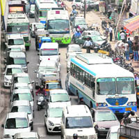 Zirakpur residents block the flyover on the Ambala-Chandigarh highway leading to traffic jam on Thursday.