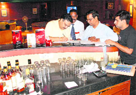 Officials of the excise and taxation department verify record of the Chandigarh Golf Club on Thursday.