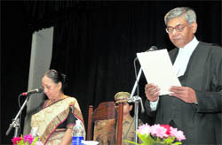 Governor Margaret Alva administers oath of office and secrecy to Uttarakhand Chief Justice Barin Ghosh in Dehradun on Thursday