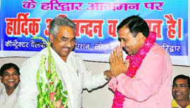 Urban Development Minister Madan Kaushik being welcomed at a function 