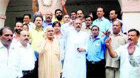 Congress workers hold a protest in Dehradun on Thursday