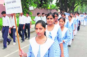 Students of Shri Krishna Parnami Senior Secondary School hold an AIDS awareness rally in Karnal