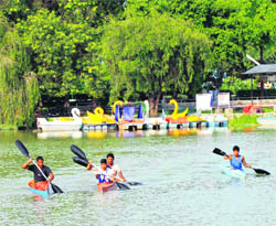Boys enjoy boating during a training camp at Karna Lake in Karnal.