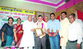 Haryana financial commissioner and poet Ramendra Jakhu Sahil and Prof Shyam Vashistha Shahid receive the Saraswati Samman and the Rajesh Chetan Kavya Puruskar, respectively, from Rajya Sabha MP Shadi Lal Batra at a function in Bhiwani.