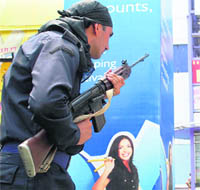 A policeman in action during a mock drill in Gurgaon on Tuesday. 