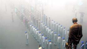 Police personnel and students braving the rain during rehearsal for the Independence Day at Shimla on Thursday.