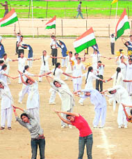 Schoolchildren take part in the Independence Day rehearsal at the Mini Stadium in Parade on Thursday.