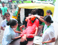 Nurses carry Zulekha, who gave birth to a baby in an auto outside General Hospital, Sector 6, Panchkula, on Friday.