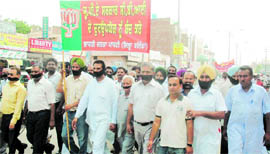 Activists of the BJP hold a protest march in Bathinda on Friday