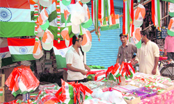 A shopkeeper sells flags, caps and other items in Dehradun