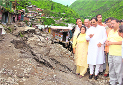 Chief Minister Ramesh Pokhriyal Nishank inspects a damaged market at Bhatwari town