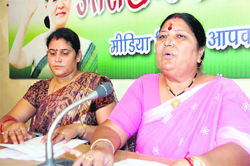 Sarojini Kaintura, Uttarakhand Women Congress president, addresses a press conference in Dehradun