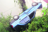 A car overturns in Mussoorie