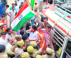 The police arrests activists of the Bharatiya Janata Yuva Morcha near Hari Palace on the Manda road in Jammu on Saturday.