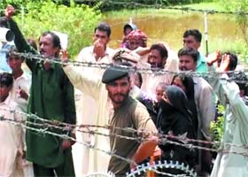 Families on the Pakistan side waving to their kin in Indian territory at Sadiqi JCP