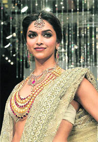 Bollywood actress Deepika Padukone wears an oufit by designer Farah Khan at the finale of India International Jewellery Week 2010 in Mumbai on Sunday. 