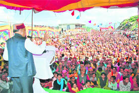 Chief Minister PK Dhumal addresses a gathering on the occasion of the Independence Day at Karsog in Mandi district on Sunday.