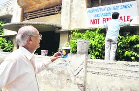 Surinder Jathaul gets his property painted to keep land grabbers away in Ludhiana