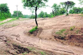 A part of a hillock that was excavated by a mafia in Puhari village, near Dasuya, in Hoshiarpur district