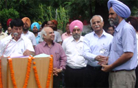Baldev Singh Sran receives the award in Patiala