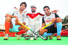 Rupinder Pal Singh (L) with coach Jasbir Bajwa and Dharamvir Singh (R). 