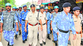 Rapid Action Force Deputy Commandant Pankaj Kumar Mishra leads a flag march in Haridwar on Tuesday.