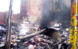 A shop gutted in a fire in Pitthoragarh on Monday night