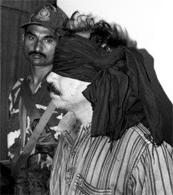A blindfolded Naxalite after his arrest