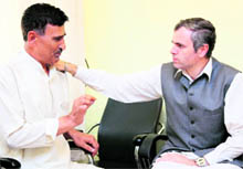 Chief Minister Omar Abdullah with suspended Head Constable Abdul Ahad Jan who had hurled a shoe towards him on Independence Day, in Srinagar on Tuesday