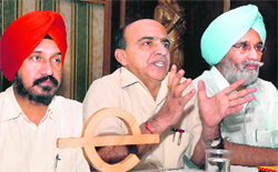 Dr Rajneesh Arora, Vice-Chancellor, Punjab Technical University (centre), addresses a press conference in Jalandhar on Tuesday. Also seen in the picture are Dr HS Bains , Registrar (left), and Dr Nachhattar Singh, Adviser to the Vice-Chancellor