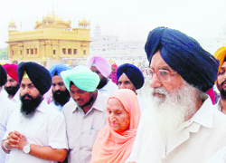 Chief Minister Parkash Singh Badal and his wife, Surinder Kaur, visit the Golden Temple to pay obeisance after the latters recovery from illness, in Amritsar