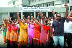 Students of the Punjabi University Regional Centre raising slogans against the fee hike in Bathinda on Wednesday. 
