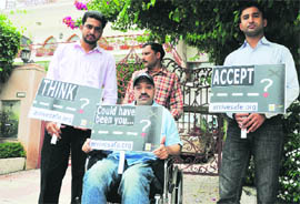 Members of ArriveSafe protest in front of the house of the suspect at Sector 36, Chandigarh, on Wednesday.