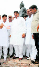 INLD secretary-general Ajay Chautala, along with his supporters, inspects the site where the floor was demolished in Karnal on Wednesday