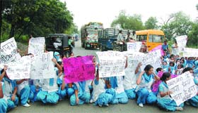 Students of the Punjab Medical Institute of Nursing, Suranussi, block the Jalandhar-Suranussi-Kartarpur road in Jalandhar
