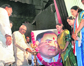 Andhra Pradesh Chief Minister K Rosaiah lights a lamp during a function organised in connection with the birth anniversary of Rajiv Gandhi,in Hyderabad