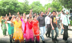Students of the Punjabi University Regional Centre protest against the hike in the fees of certain MA (part I) courses in Bathinda on Wednesday. 