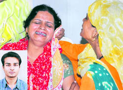 The inconsolable mother of Ravinder (inset), who was killed in an accident in Chandigarh on Thursday
