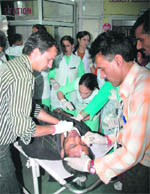 The injured being treated at the Indira Gandhi Medical College and Hospital in Shimla on Thursday. As many as 22 persons were killed when a private bus fell into a gorge near Chaila in the Theog area, 45 km from Shimla.