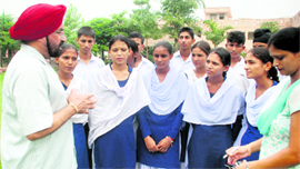 Baldev Singh with the students of SBS Government Senior Secondary School at Majatri village.
