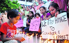 Residents light candles to remember accident victims of Kansal village in Sector 17, Chandigarh, on Friday.