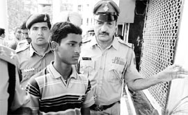 The victim with police officials in Chandigarh on Friday.