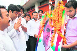 Members of the Youth Congress pay tributes to late former Prime Minister Rajiv Gandhi on his birth anniversary in Jammu on Friday.