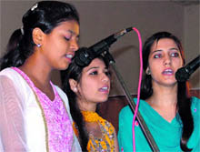 Students participate in a singing contest at Arya College in Ludhiana on Friday