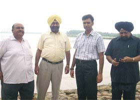 Deputy Commissioner of Jalandhar Priyank Bharti inspects the Dhussi bundh along the Sutlej near Phillaur