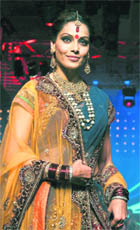 Bollywood actress Bipasha Basu displays a creation by Vikram Phadnis at a fashion show for Gitanjali Jewellers in Mumbai late on Friday. 