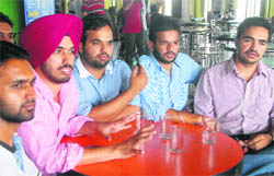 Members of SOPU announce their panel and poll agenda during a press conference in Chandigarh on Saturday.