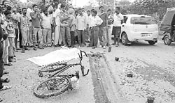 The body lies unattended on the road at Zirakpur on Saturday